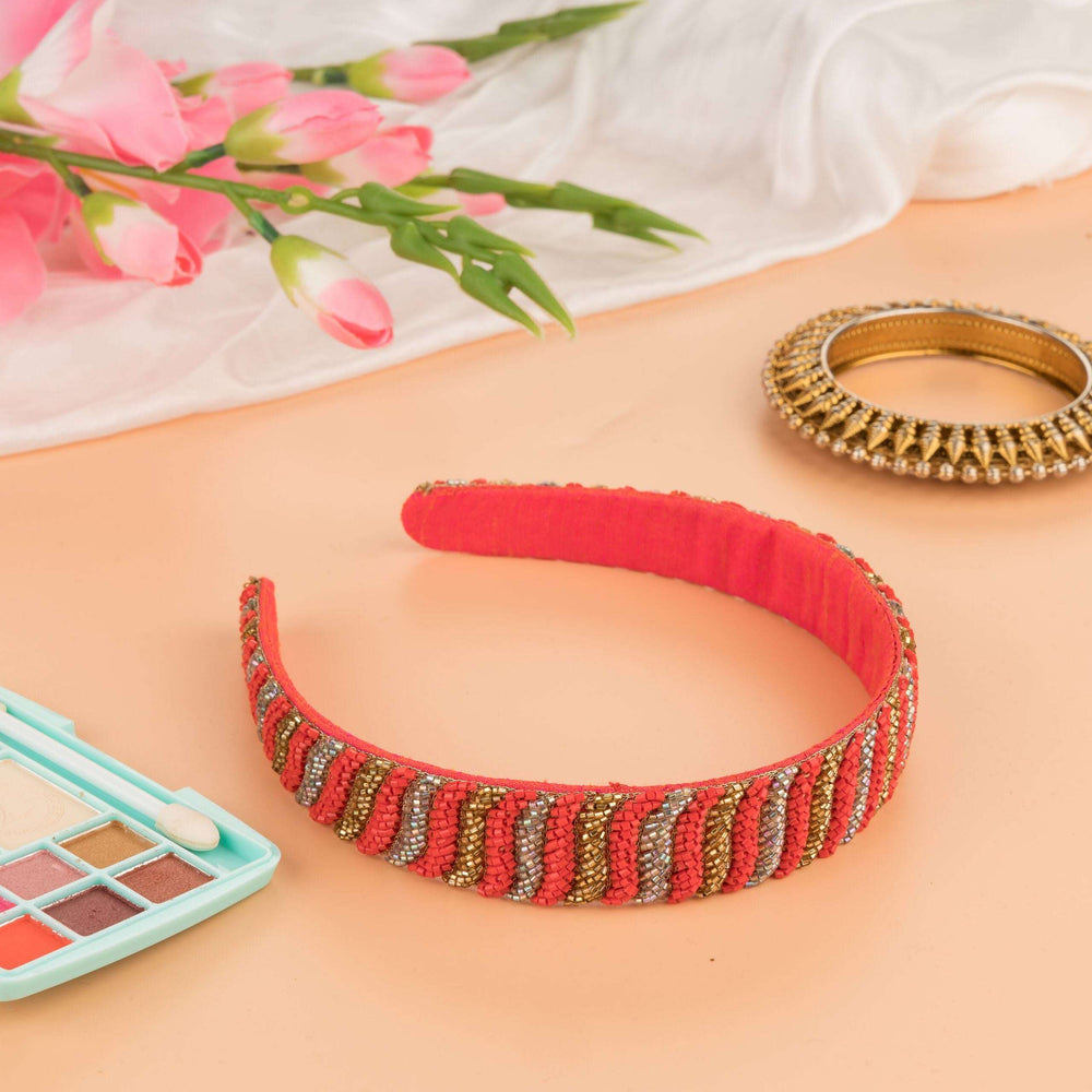 Coral headband with gold and silver katdana beadwork, styled with tulips, a bangle and eyeshadow