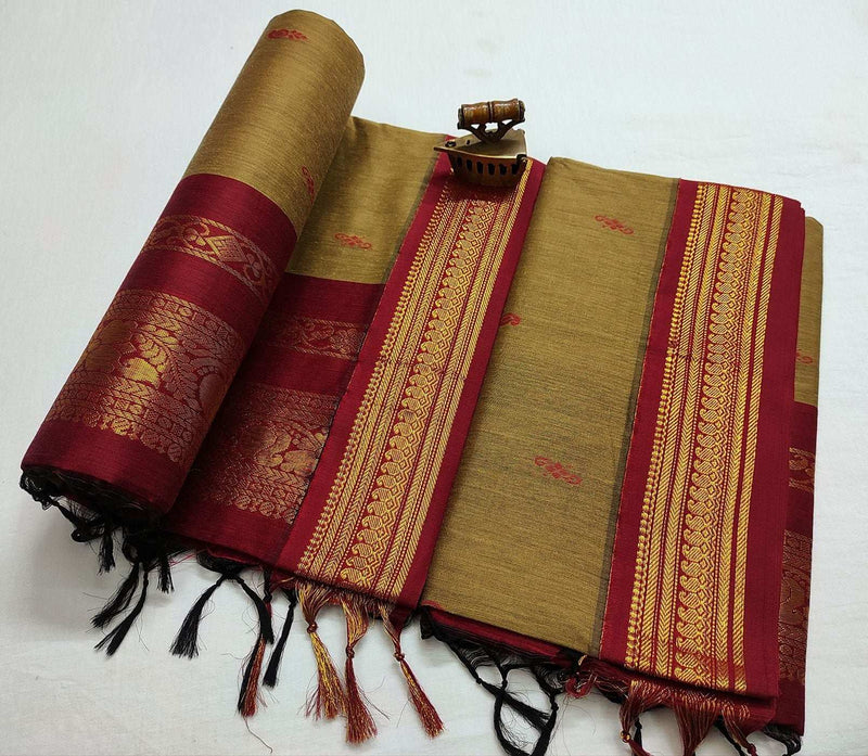Olive green Latika Gadwal saree rolled and folded, maroon border with gold zari