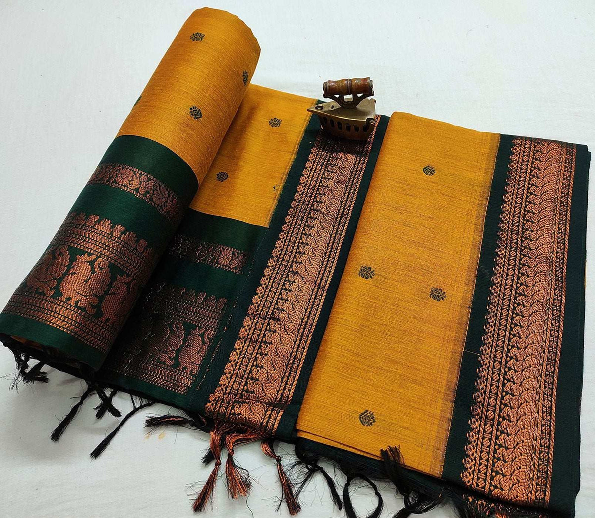 Mustard yellow Gadwal saree with dark green border and copper zari pallu
