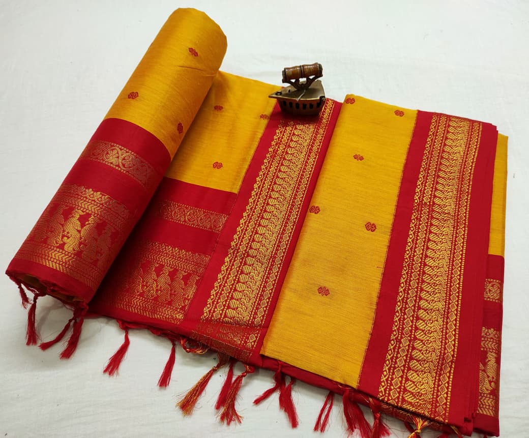 Golden yellow saree with red zari border and rows of woven figures on the pallu