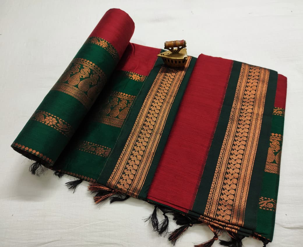 Red saree with bottle green zari border, green pallu rolled to show woven figure motifs