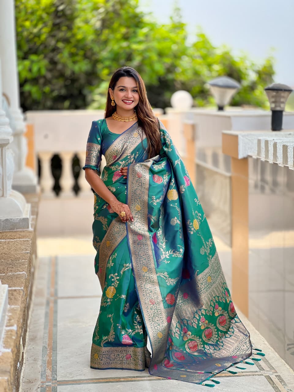 Model wearing the emerald green lotus border saree with navy border