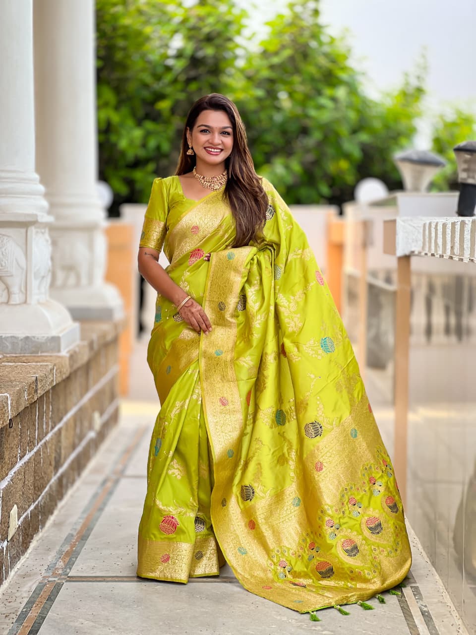 Model wearing the lime green lotus border saree