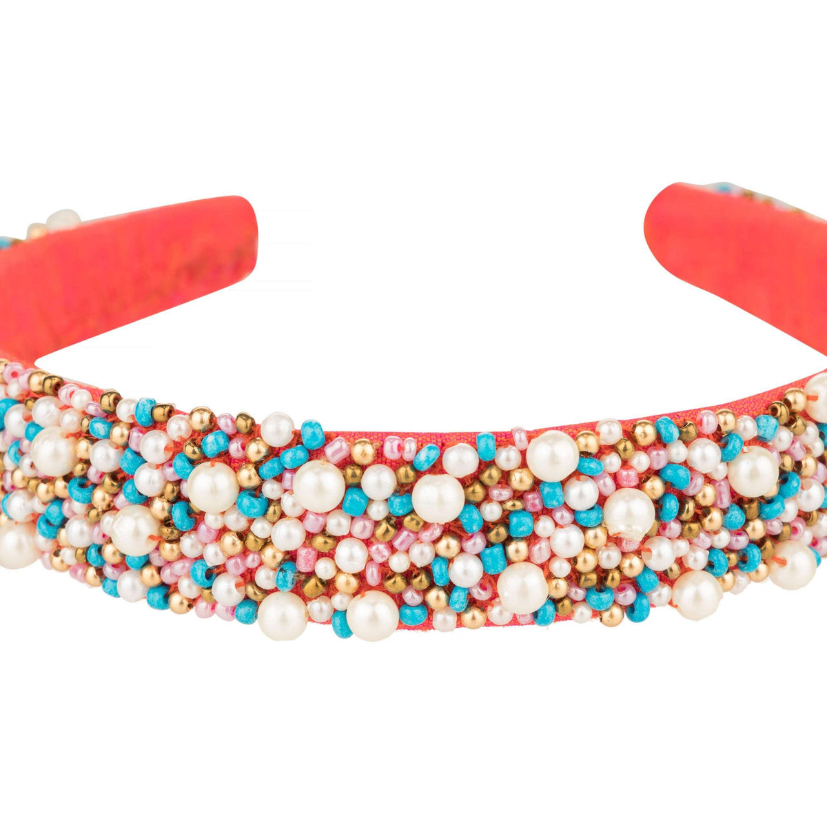 Close-up of turquoise, pink and gold beads with pearls across the headband