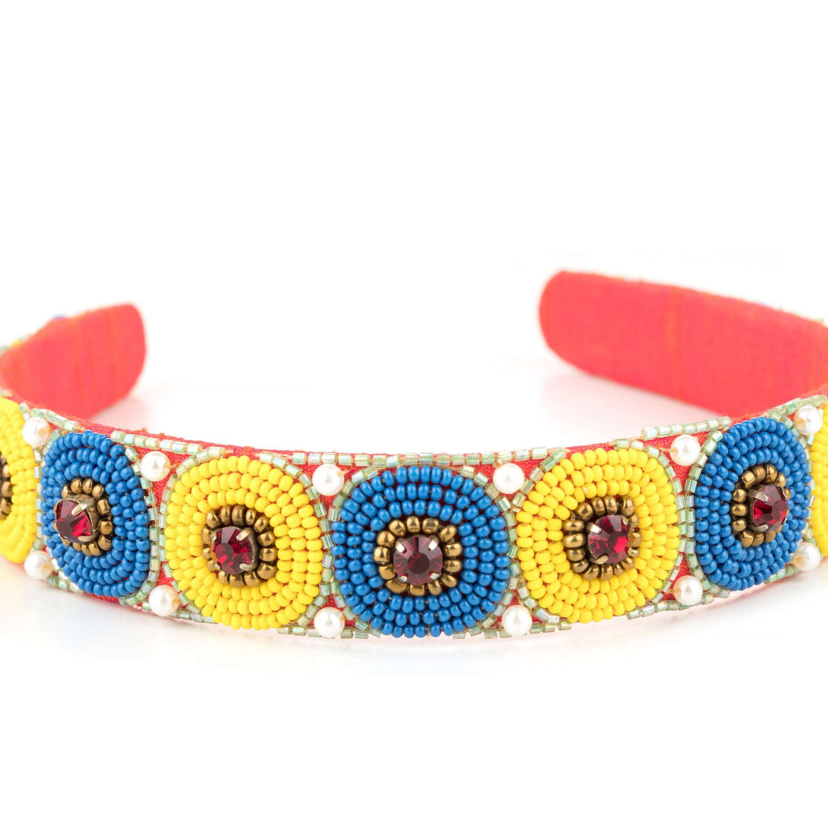 Beaded polka discs with maroon stone centres, close-up across the band