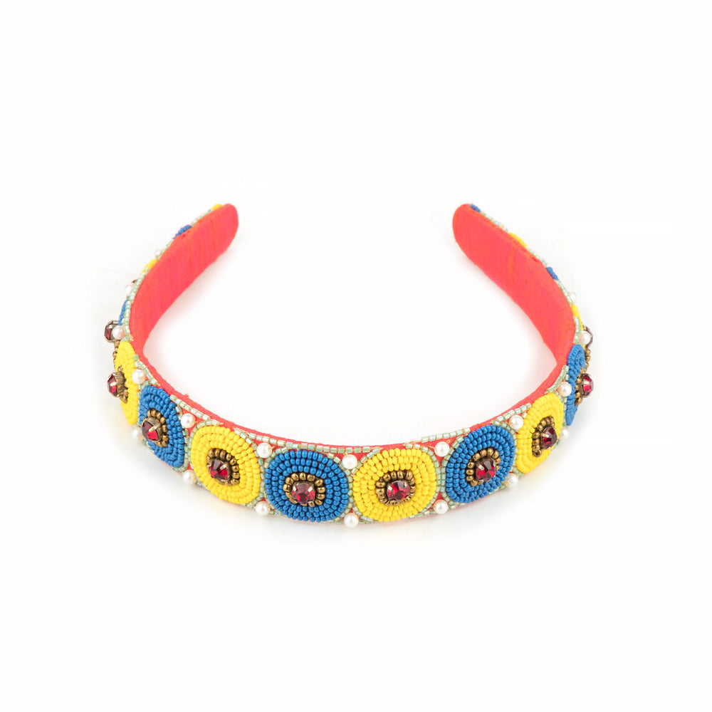Front view of the polka bead headband, red band with pearl-edged discs