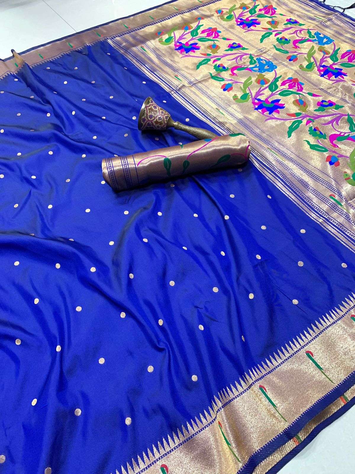 Royal blue Muniya Paithani saree with zari bootis and a gold temple-pattern border