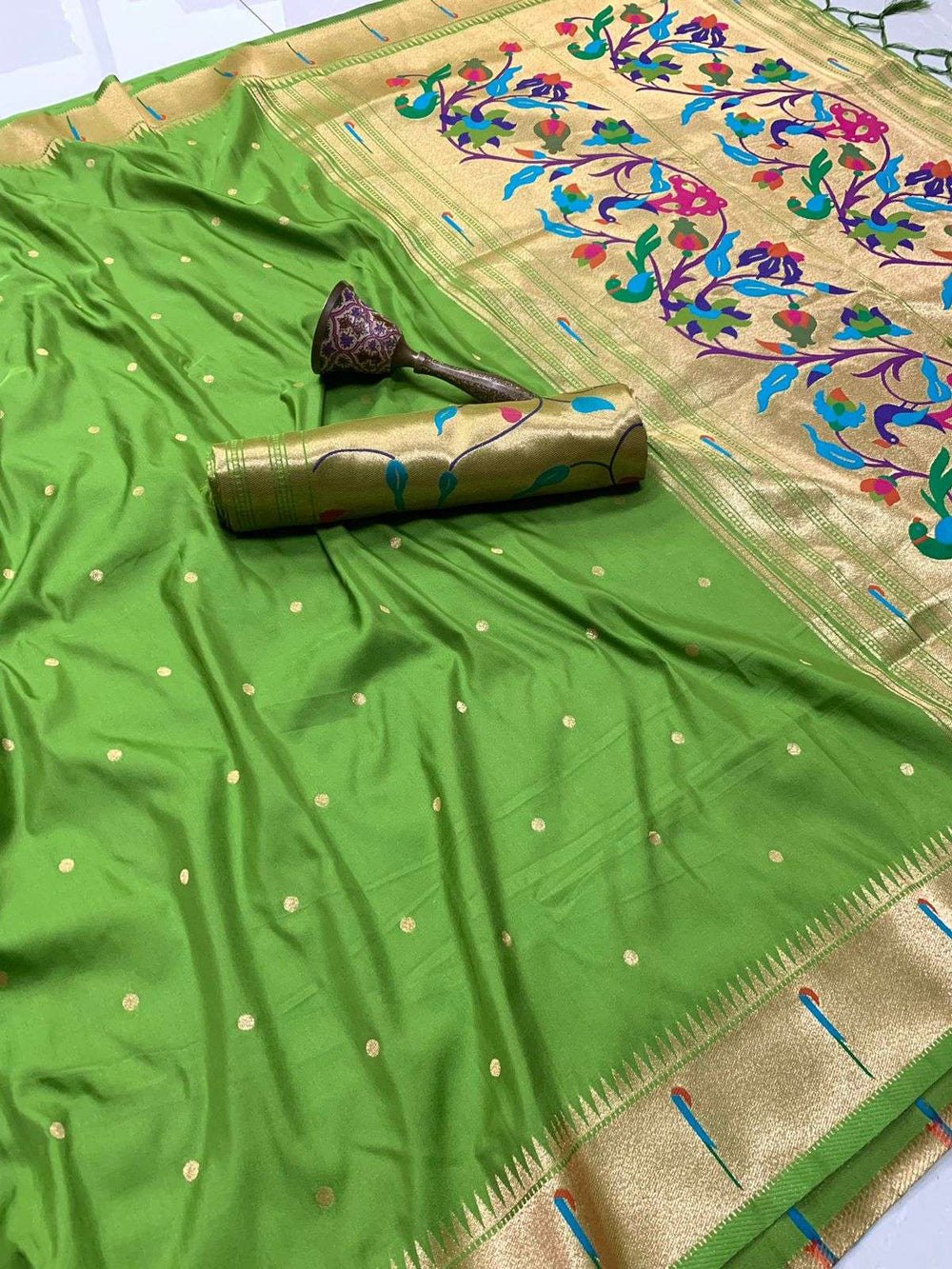 Parrot green Paithani saree with gold bootis and muniya pallu woven in bright meenakari colours