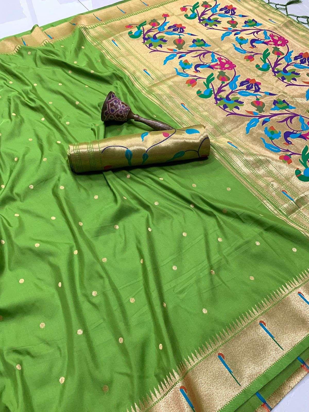 Parrot green Paithani saree with gold bootis and muniya pallu woven in bright meenakari colours