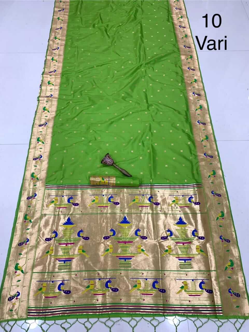 Parrot green saree shown full length, gold tissue pallu with peacock and vase motifs