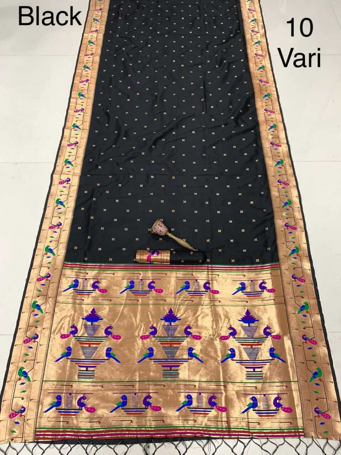 Black saree laid flat with zari bootis and a gold pallu of peacocks and vase motifs