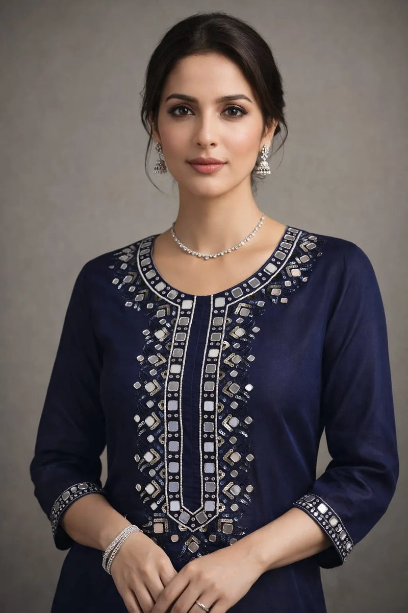 Model in a navy blue kurta with mirror-work yoke placket and cuff detail