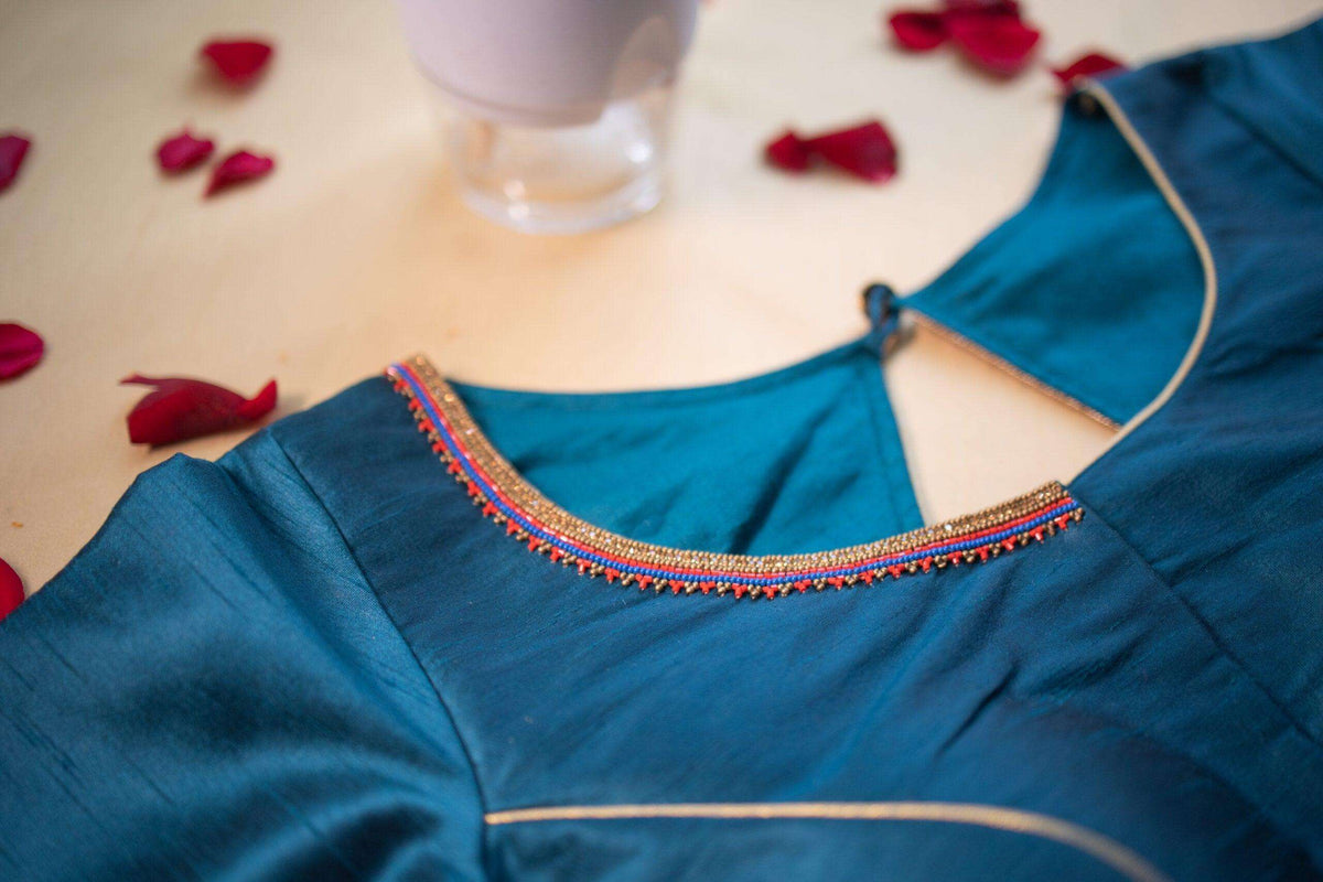 Beaded pink and gold edging along the back neckline, shoulder detail