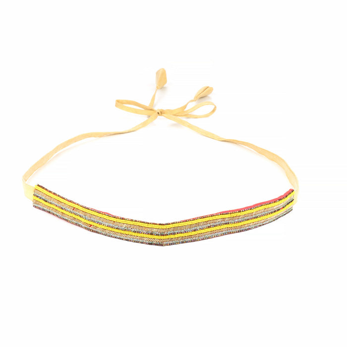 Saree belt curved into a V with its yellow fabric tie-cords knotted in a bow above