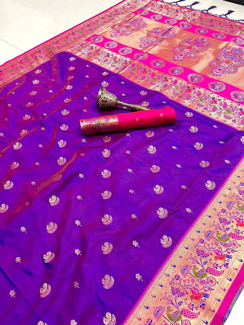Violet Paithani saree flat-laid with rani pink border and gold peacock pallu