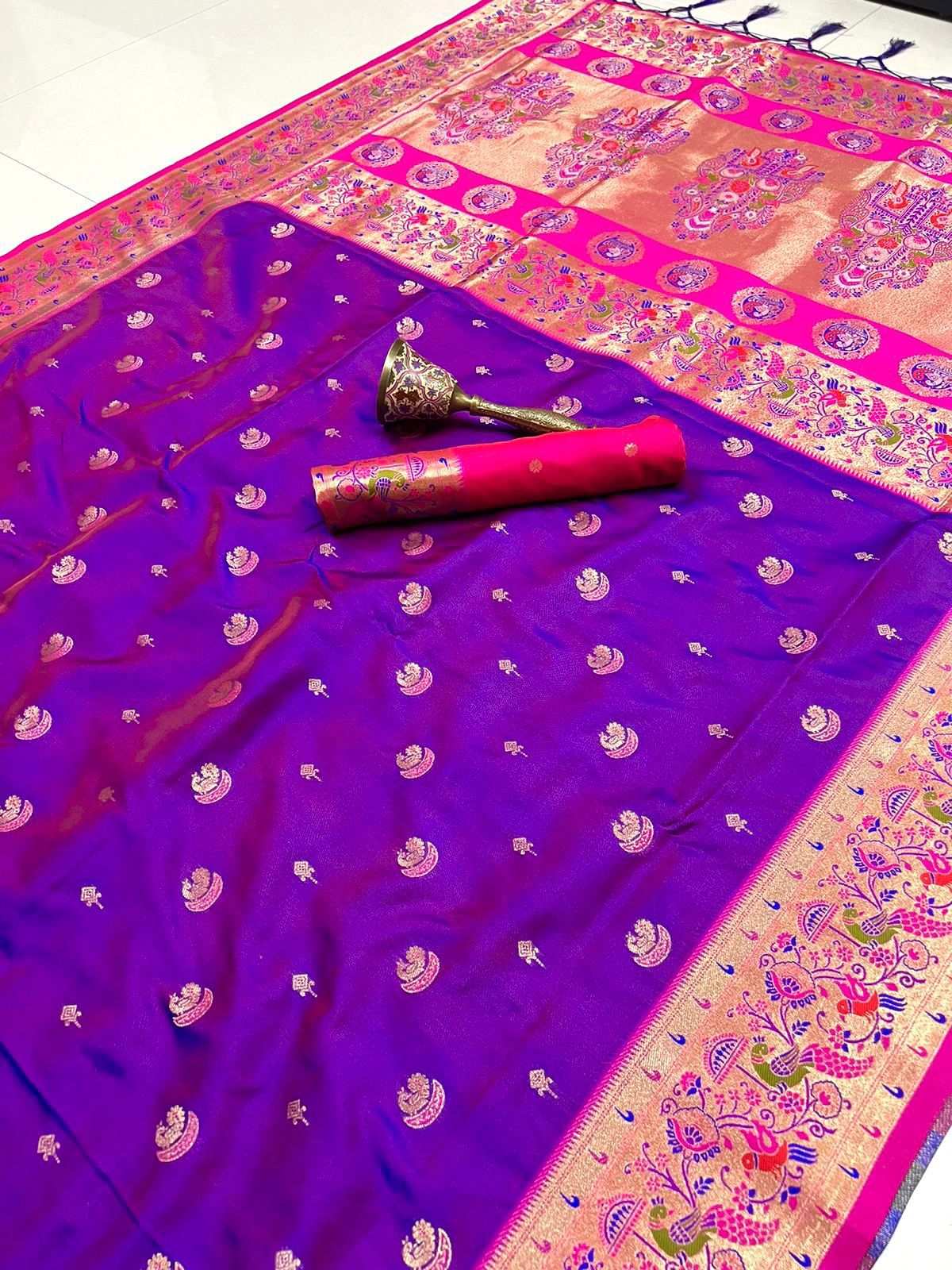 Violet Paithani saree flat-laid with rani pink border and gold peacock pallu