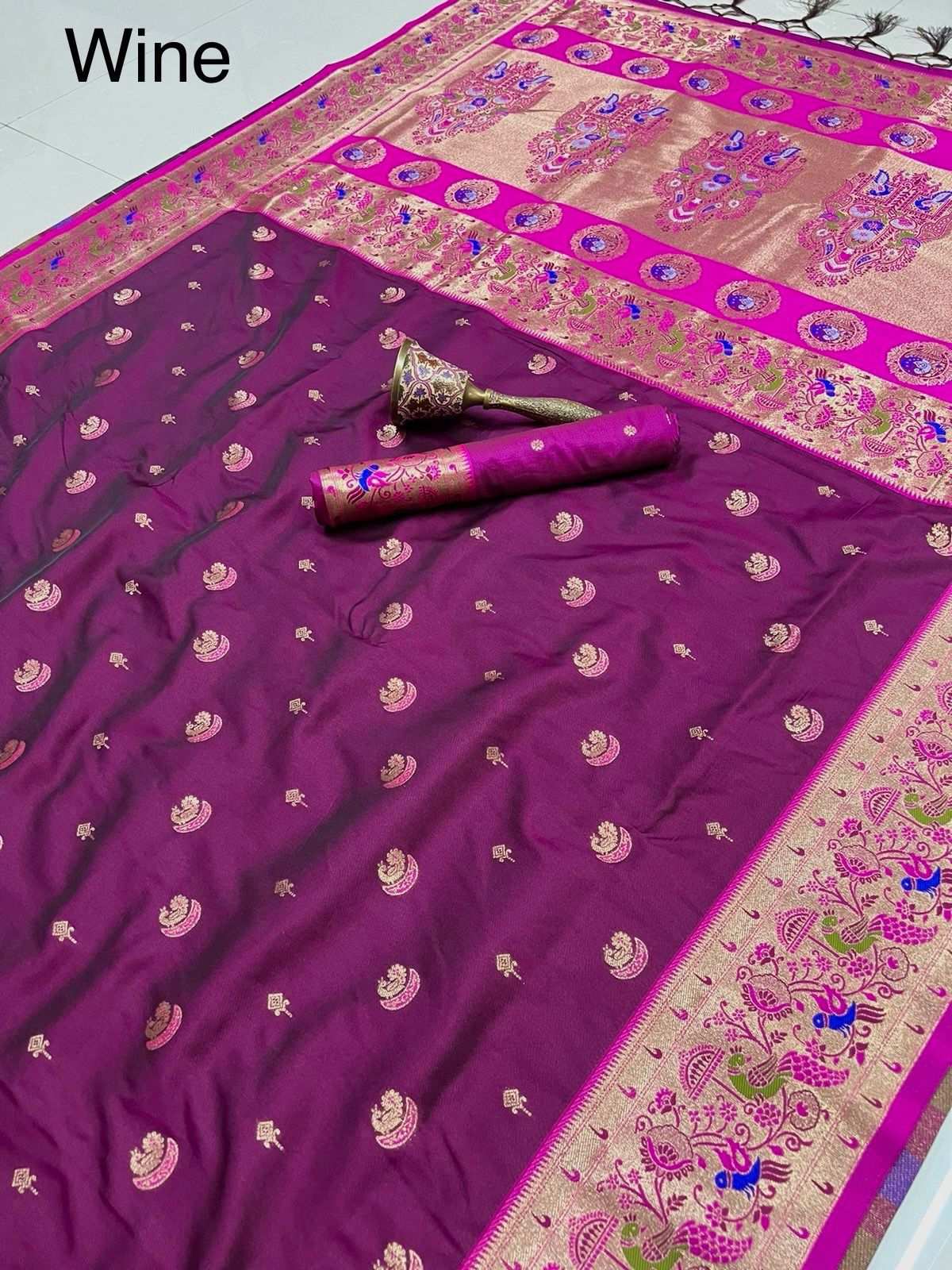 Wine colourway of the peacock border Paithani, zari bootis across the body