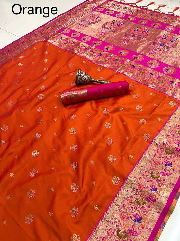Orange Paithani saree with rani pink peacock border, folded flat-lay