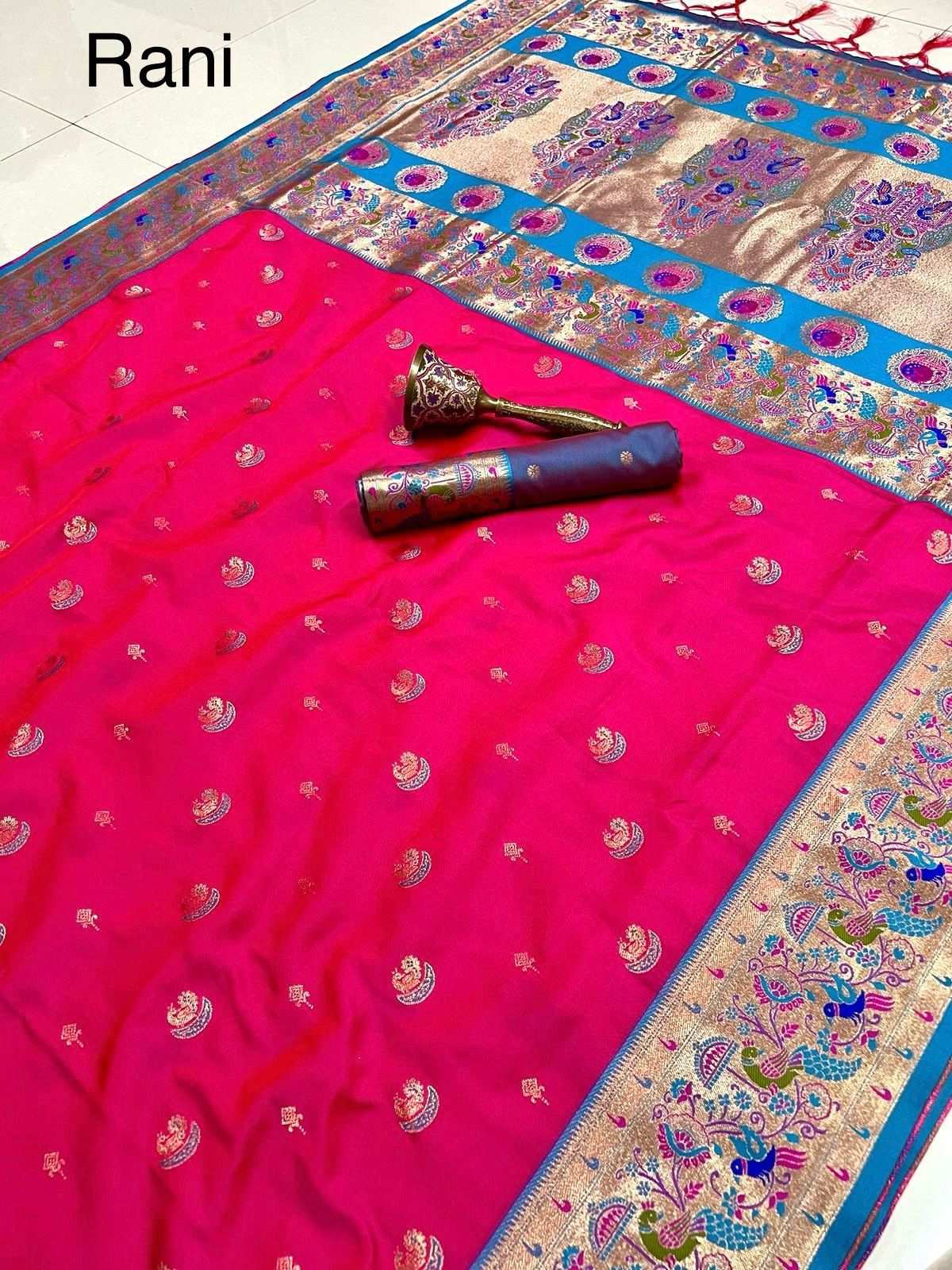 Rani pink Paithani saree with contrast firozi blue peacock border
