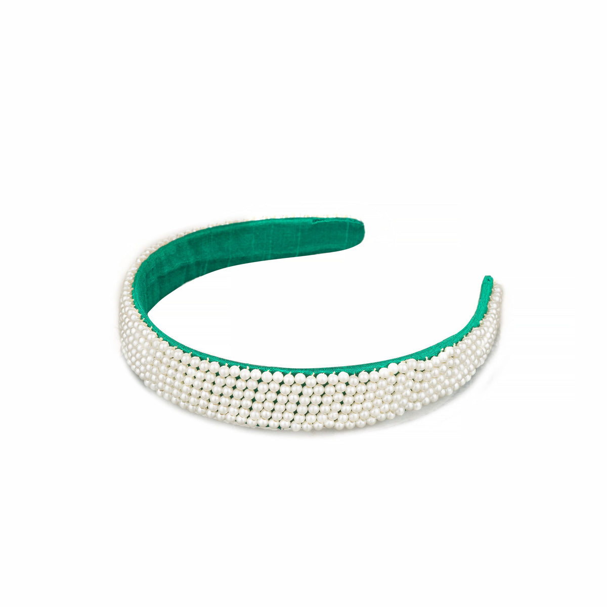 Angled view of the pearl headband showing the green wrapped band behind