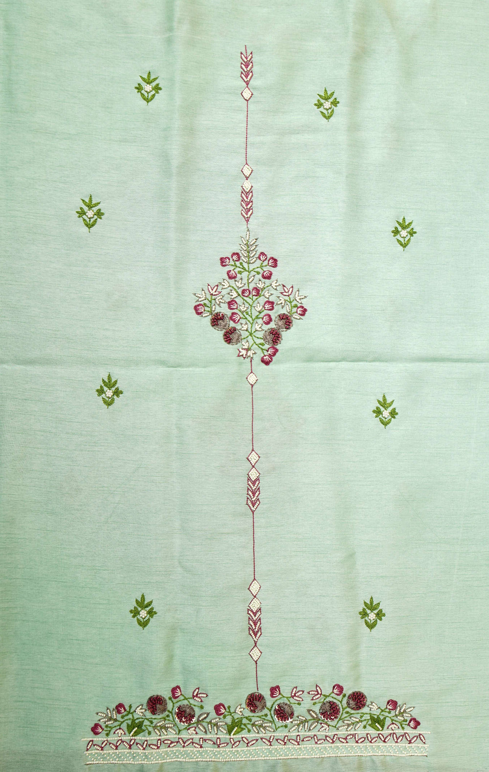 Kurta panel of the unstitched set laid flat, central floral motif with a bootied ground and hem border