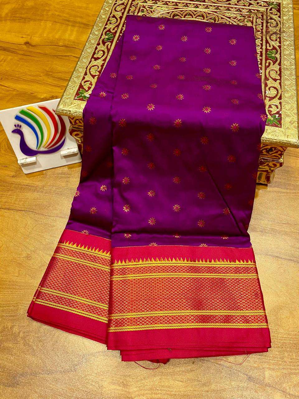 Purple body with gold bootis folded beside the red kadiyal border