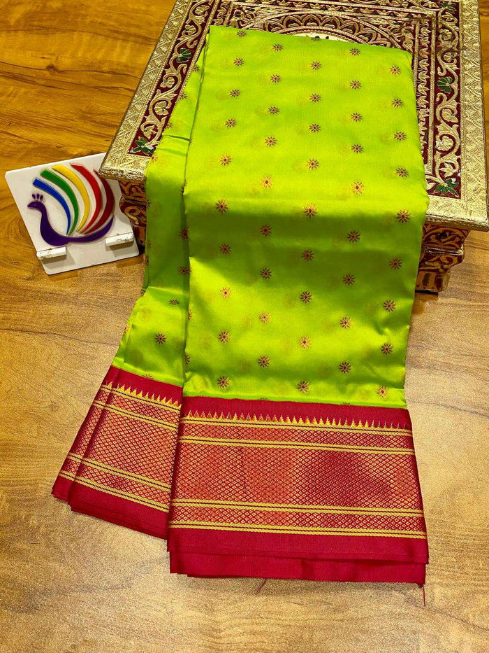 Parrot green body with fine bootis, contrast red kadiyal border in gold zari