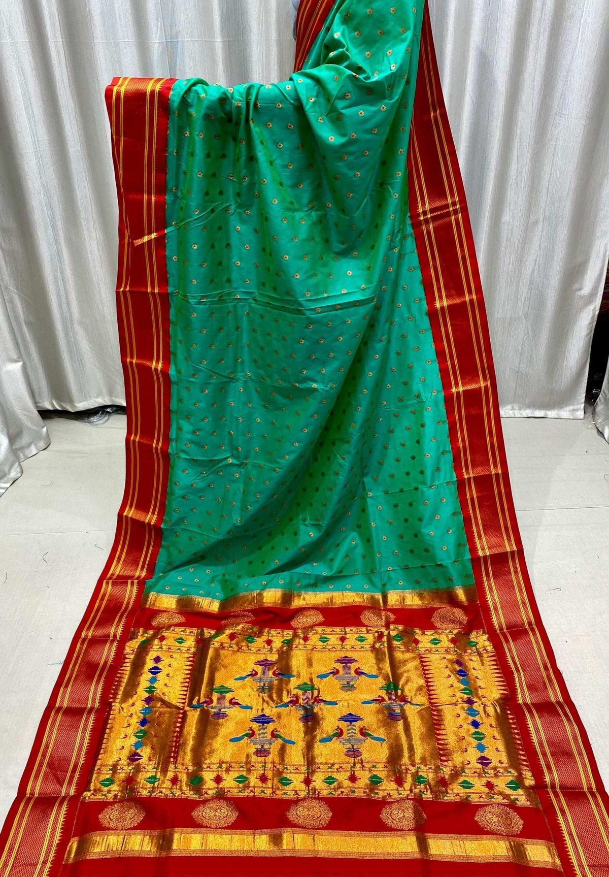 Green kadiyal Paithani in full drape, gold pallu with woven figure motifs