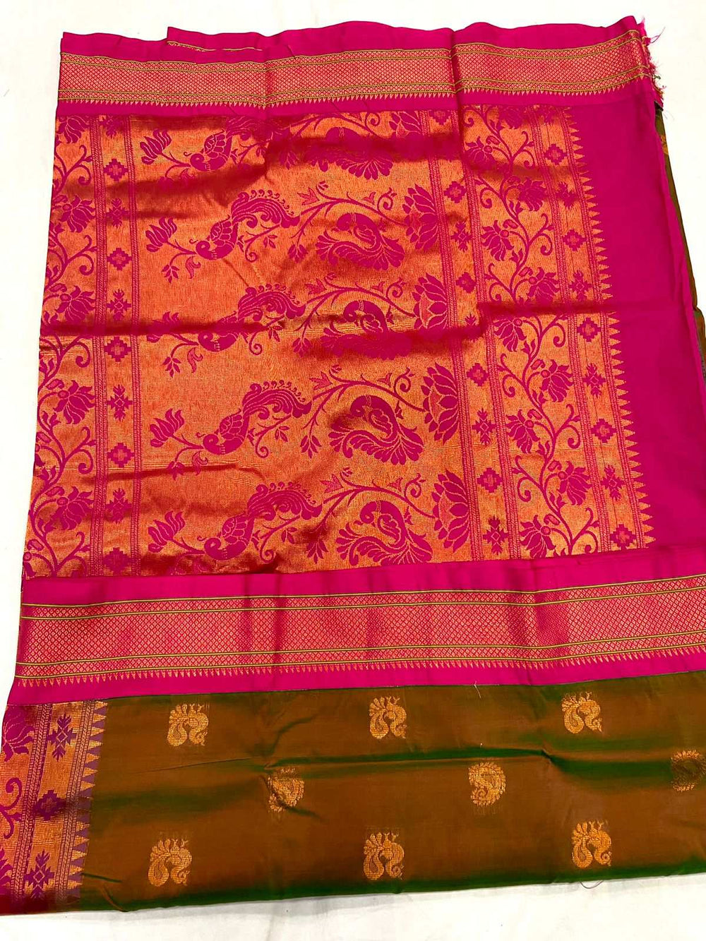 Rani pink pallu of the Paithani saree, dense gold peacock and floral brocade