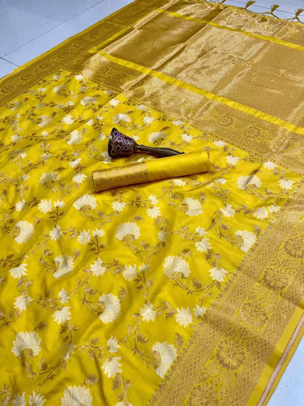 Yellow semi silk designer saree spread flat, cream floral jaal with zari border