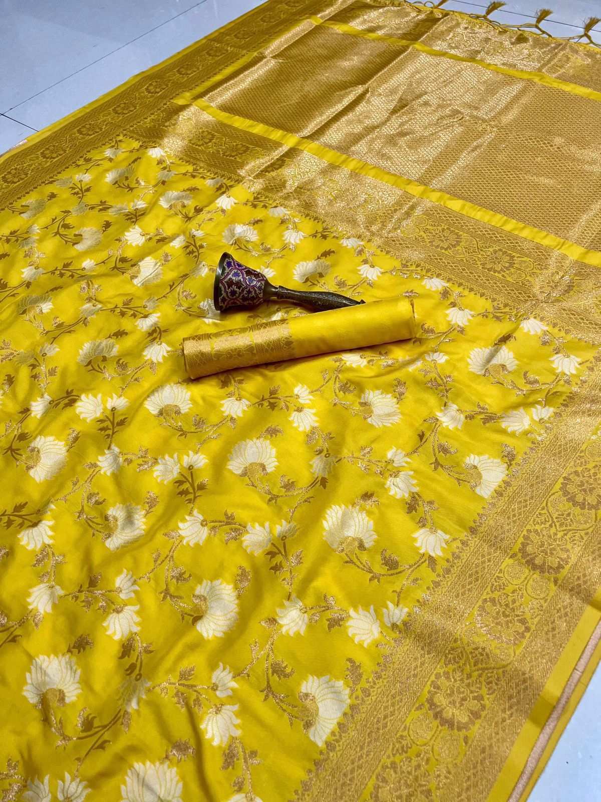 Yellow semi silk designer saree spread flat, cream floral jaal with zari border
