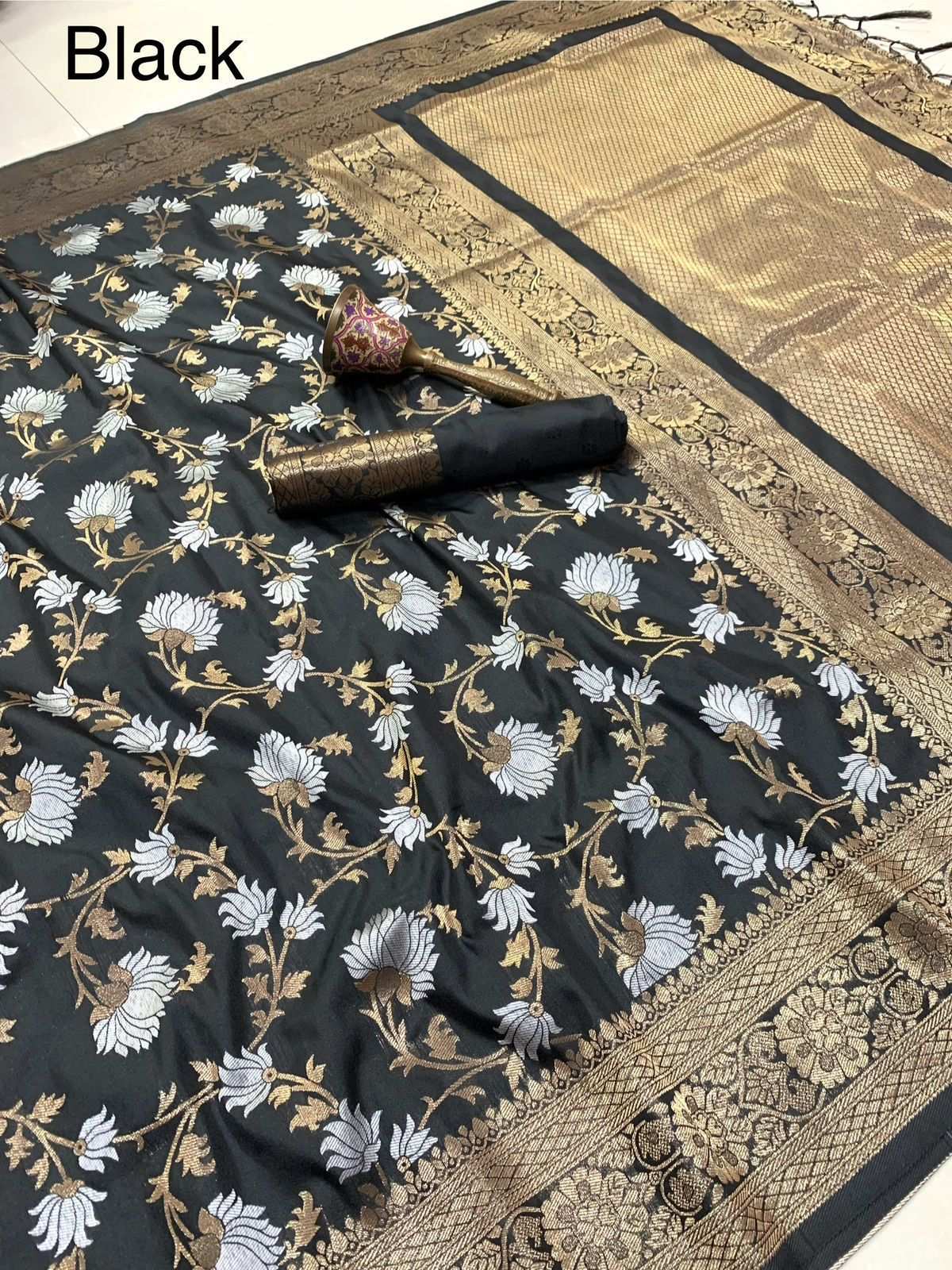Black colourway of the semi silk saree in silver and gold floral jaal, labelled Black