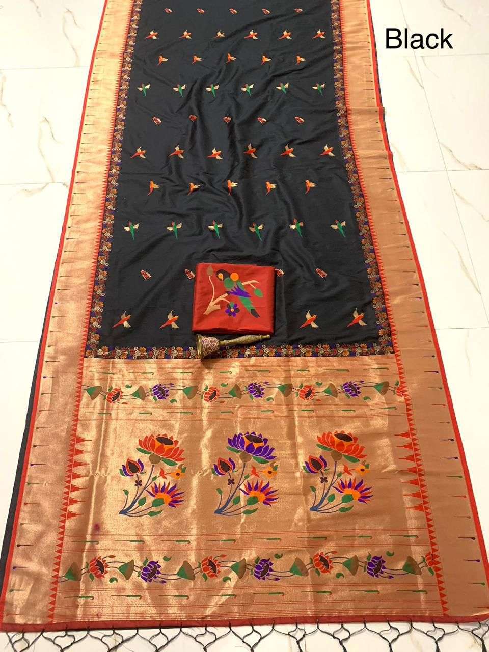 Black saree with red border, muniya parrot bootis scattered on the body