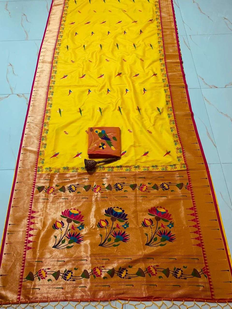 Yellow single muniya Paithani saree with pink-red border and gold lotus pallu
