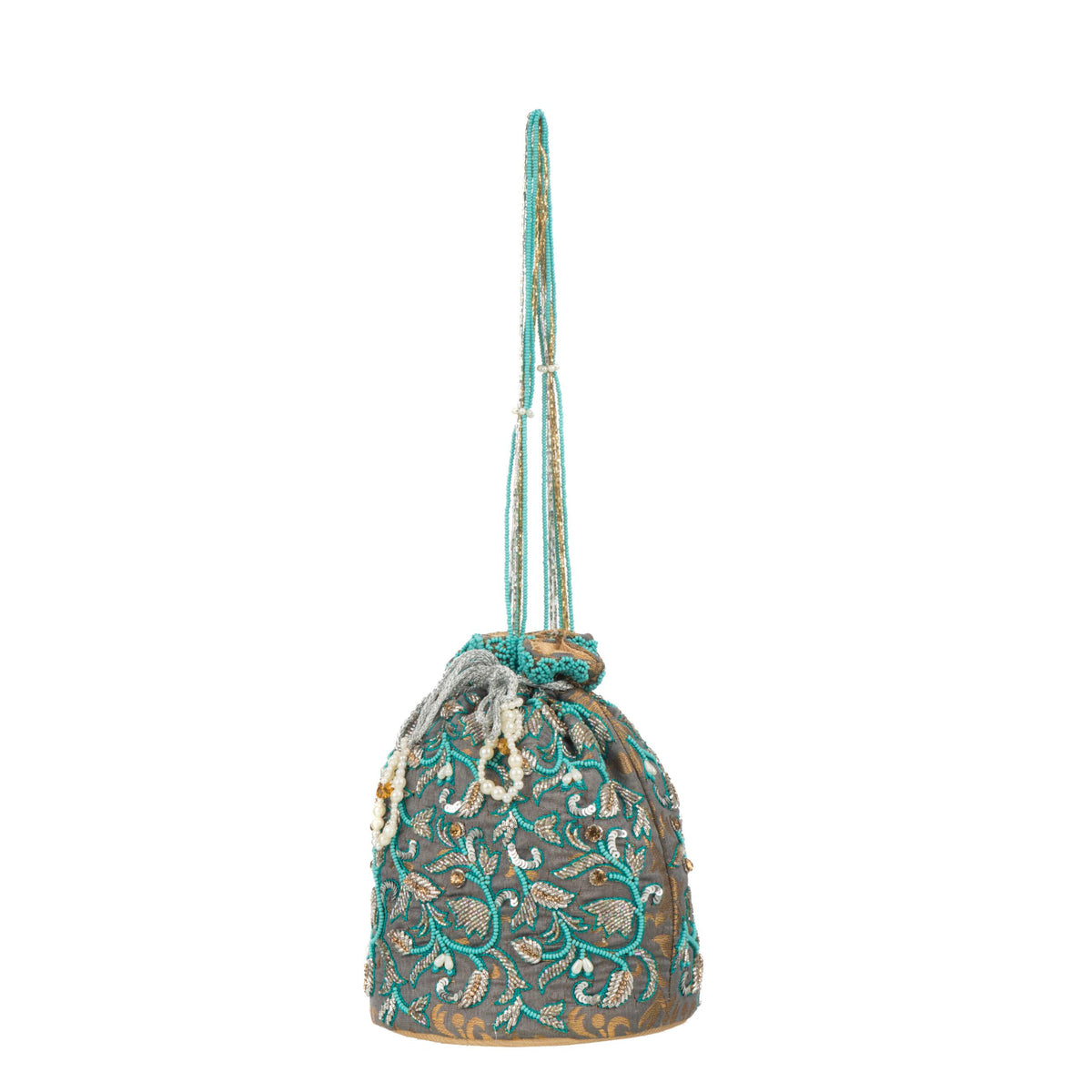 Full height with the long turquoise beaded handle extended above the bag
